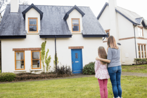 mom and daughter looking at a house